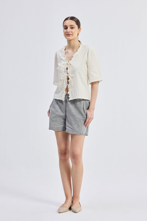 Reistor Relaxed Fit Top With Ruffles and Front-Ties in Cream