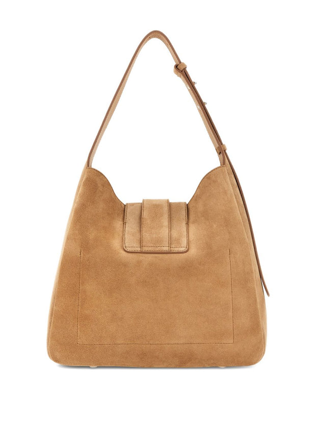 Tan suede handbag with a strap on a white background