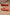 Chloe Gosselin By Larroudé Anah Mule In Orange Sunrise Satin