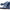 Larroude Florence Broderie Flat Sandal In Tie Dye Blue Raffia