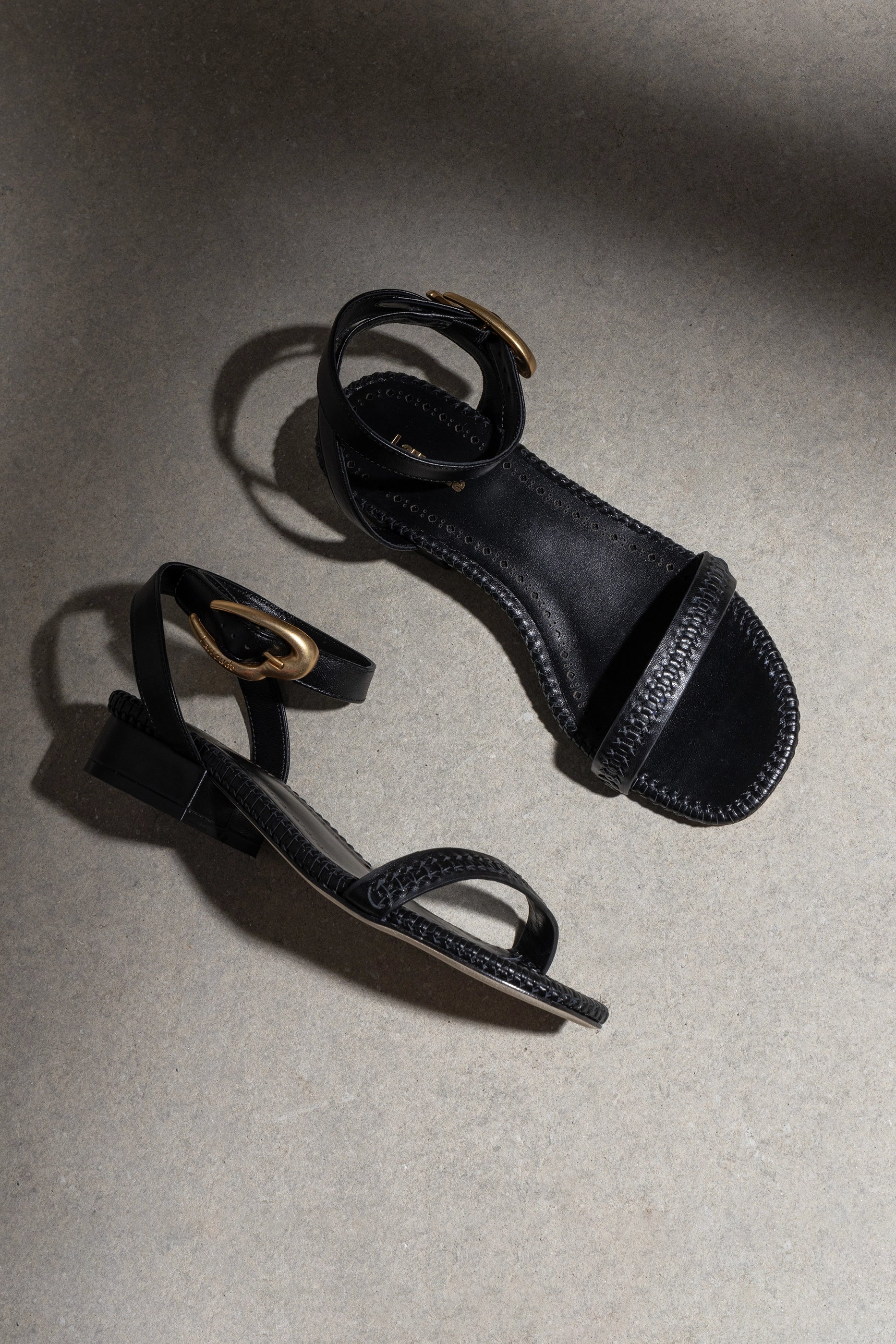 Larroude Verona Flat Sandal In Black Leather