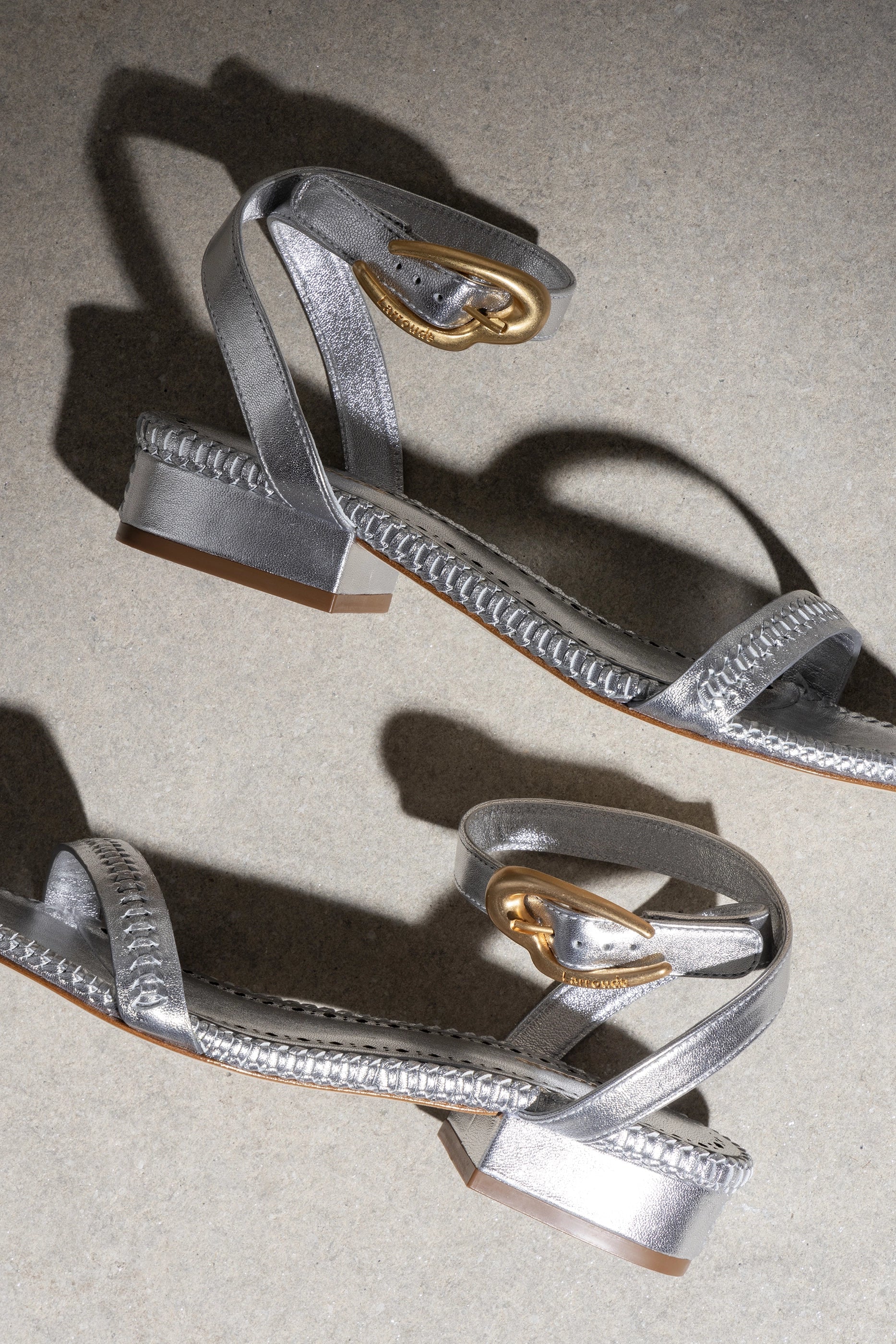 Larroude Verona Flat Sandal In Silver Metallic Leather