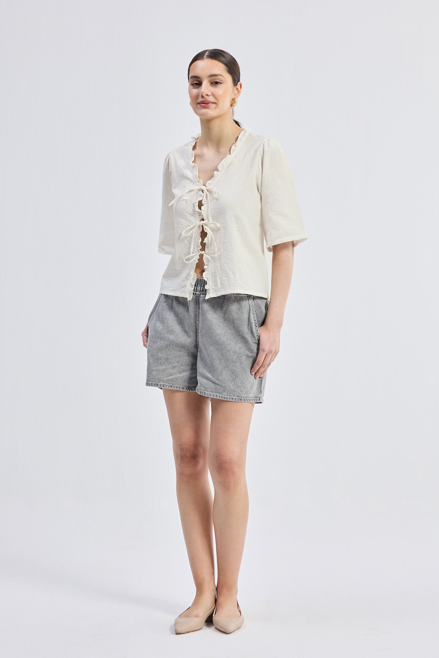 Reistor Relaxed Fit Top With Ruffles and Front-Ties in Cream