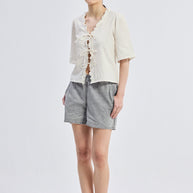 Reistor Relaxed Fit Top With Ruffles and Front-Ties in Cream