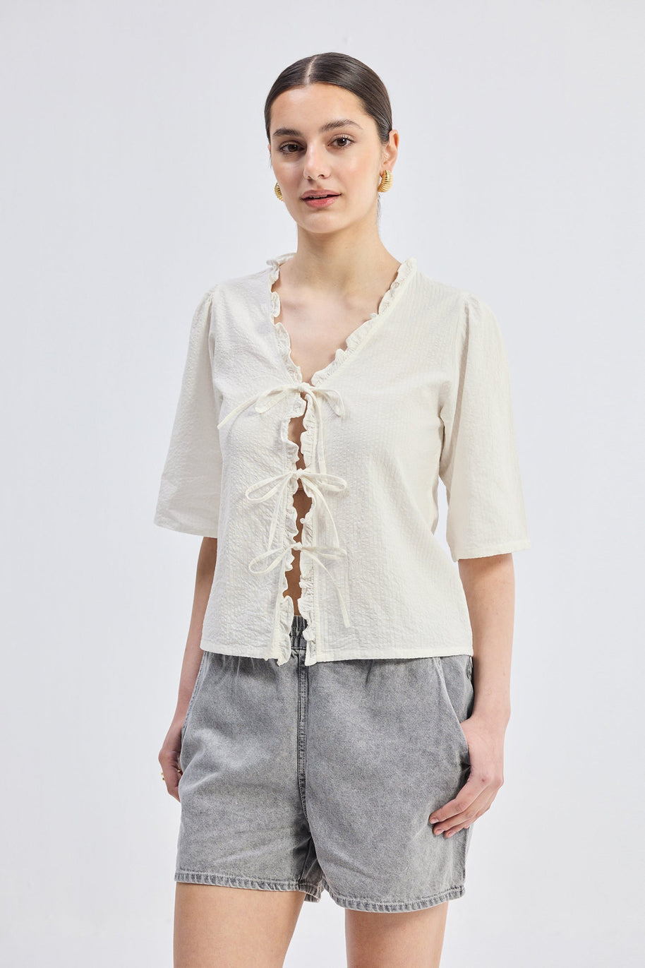 Reistor Relaxed Fit Top With Ruffles and Front-Ties in Cream
