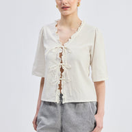 Reistor Relaxed Fit Top With Ruffles and Front-Ties in Cream
