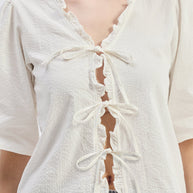 Reistor Relaxed Fit Top With Ruffles and Front-Ties in Cream