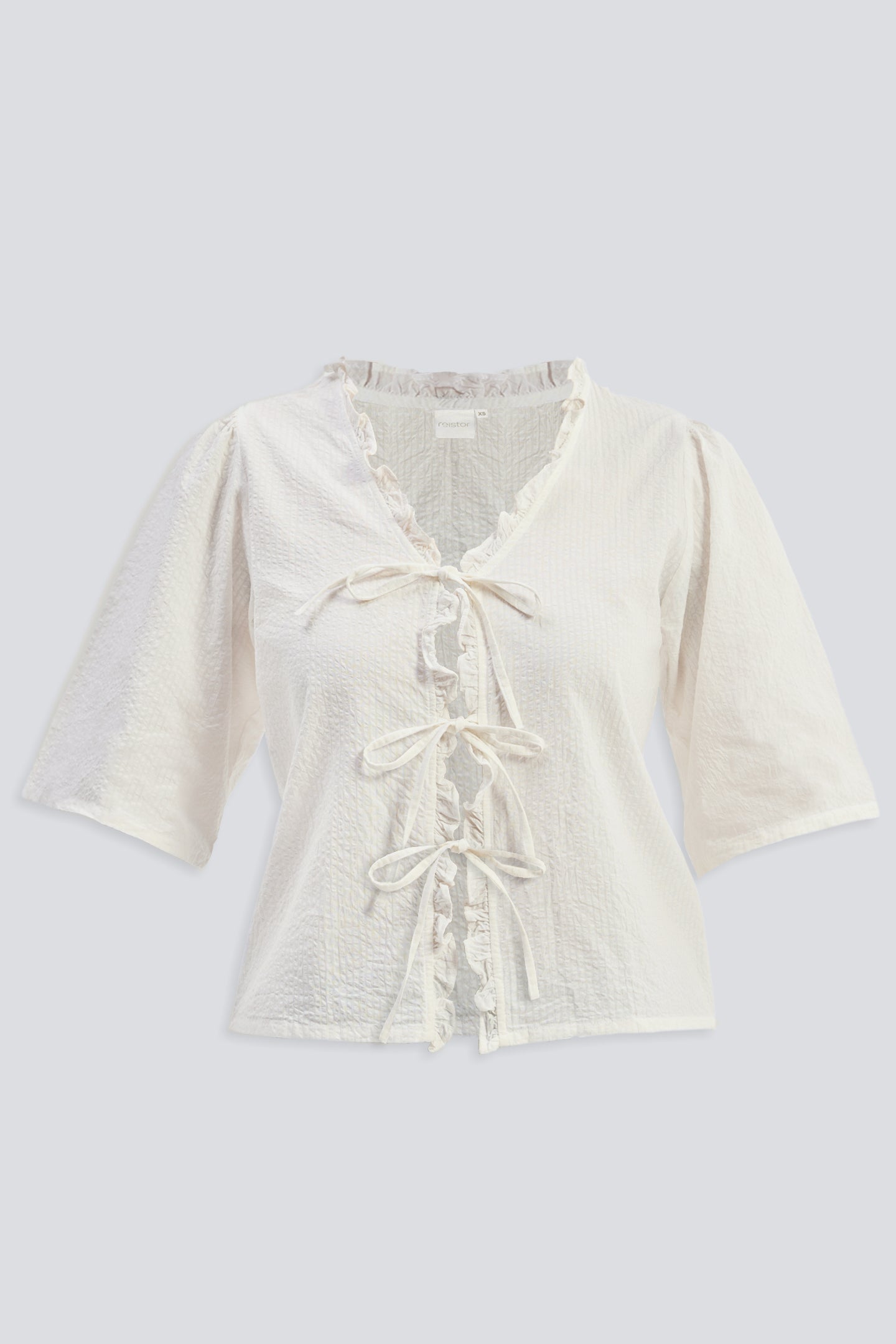 Reistor Relaxed Fit Top With Ruffles and Front-Ties in Cream